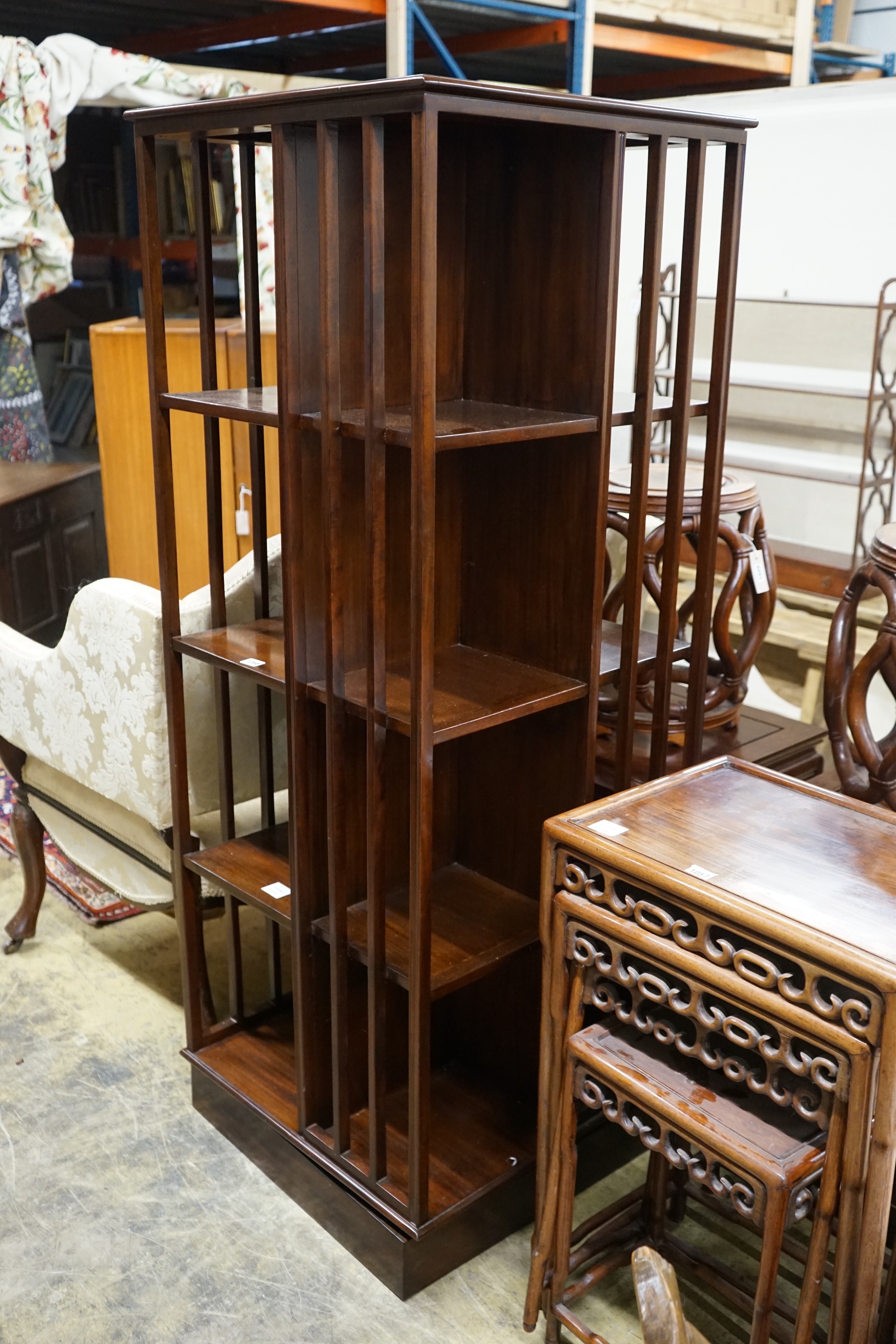 A tall reproduction Edwardian style revolving mahogany bookcase, width 60cm, height 159cm